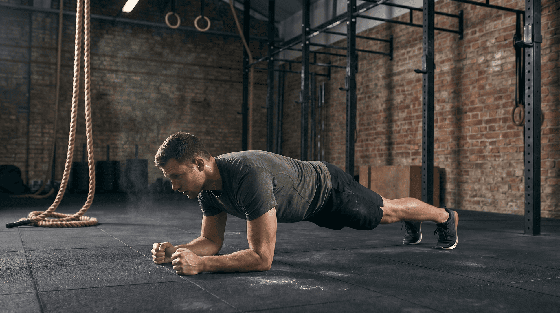 Man performing a forearm plank