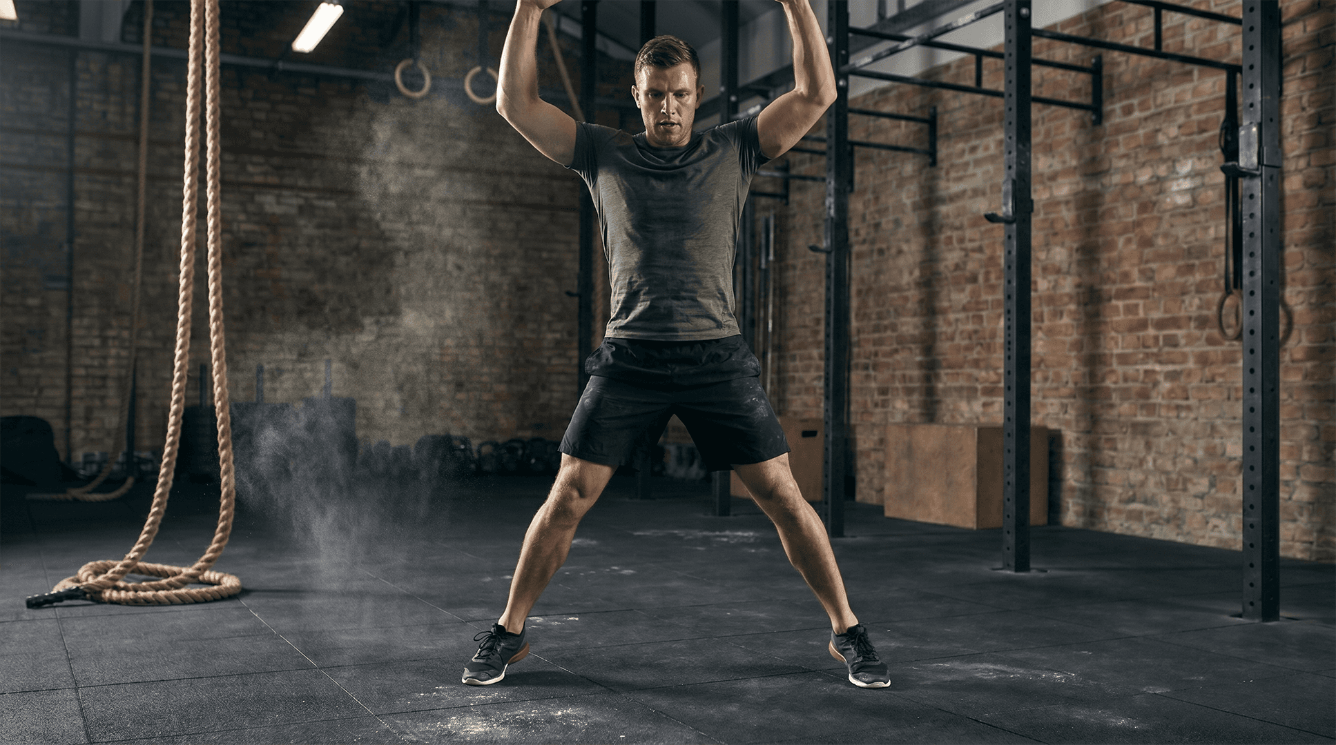 Man performing jumping jacks